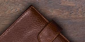 leather wallet on wood surface